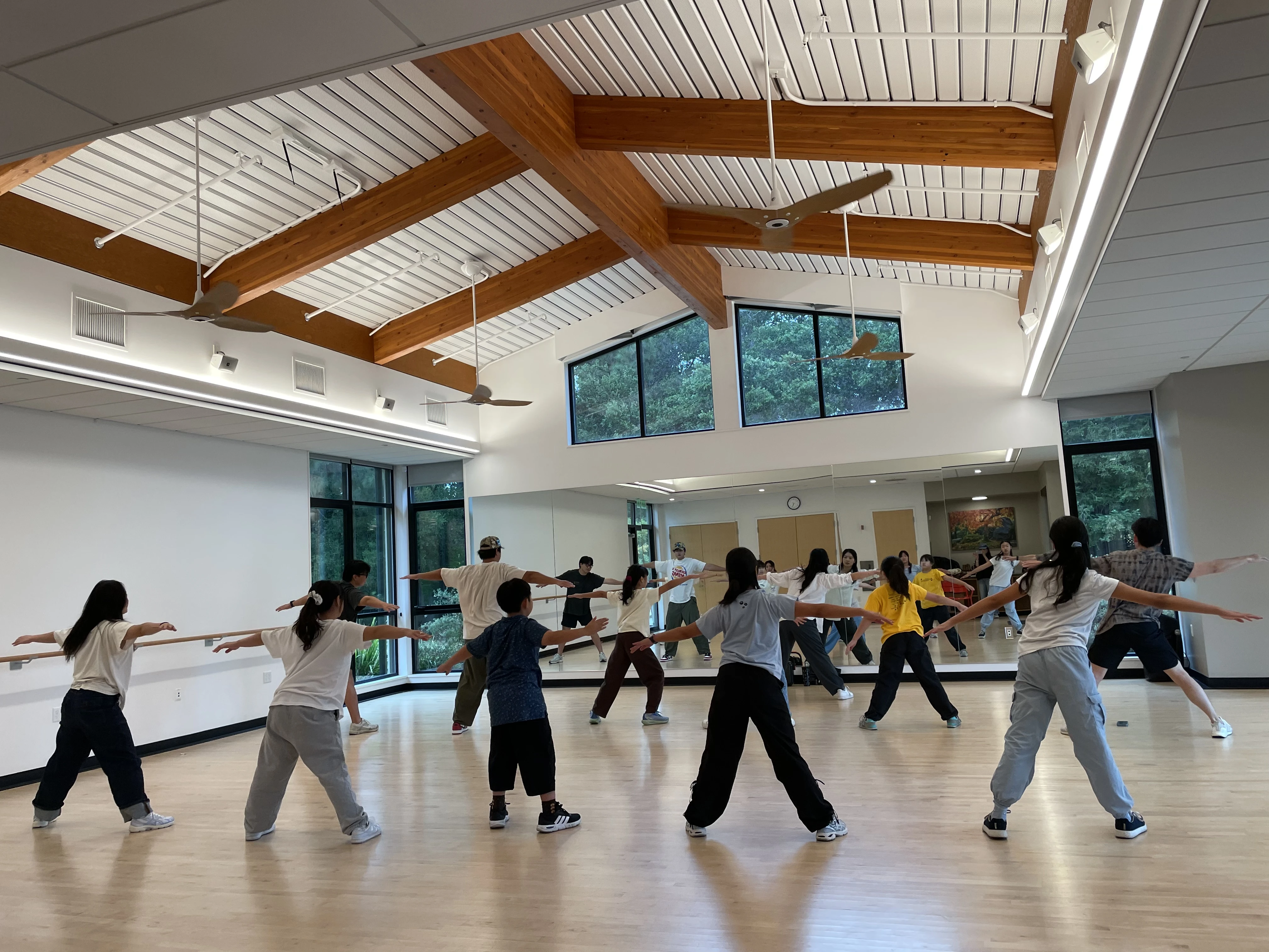 Students arms spread wide